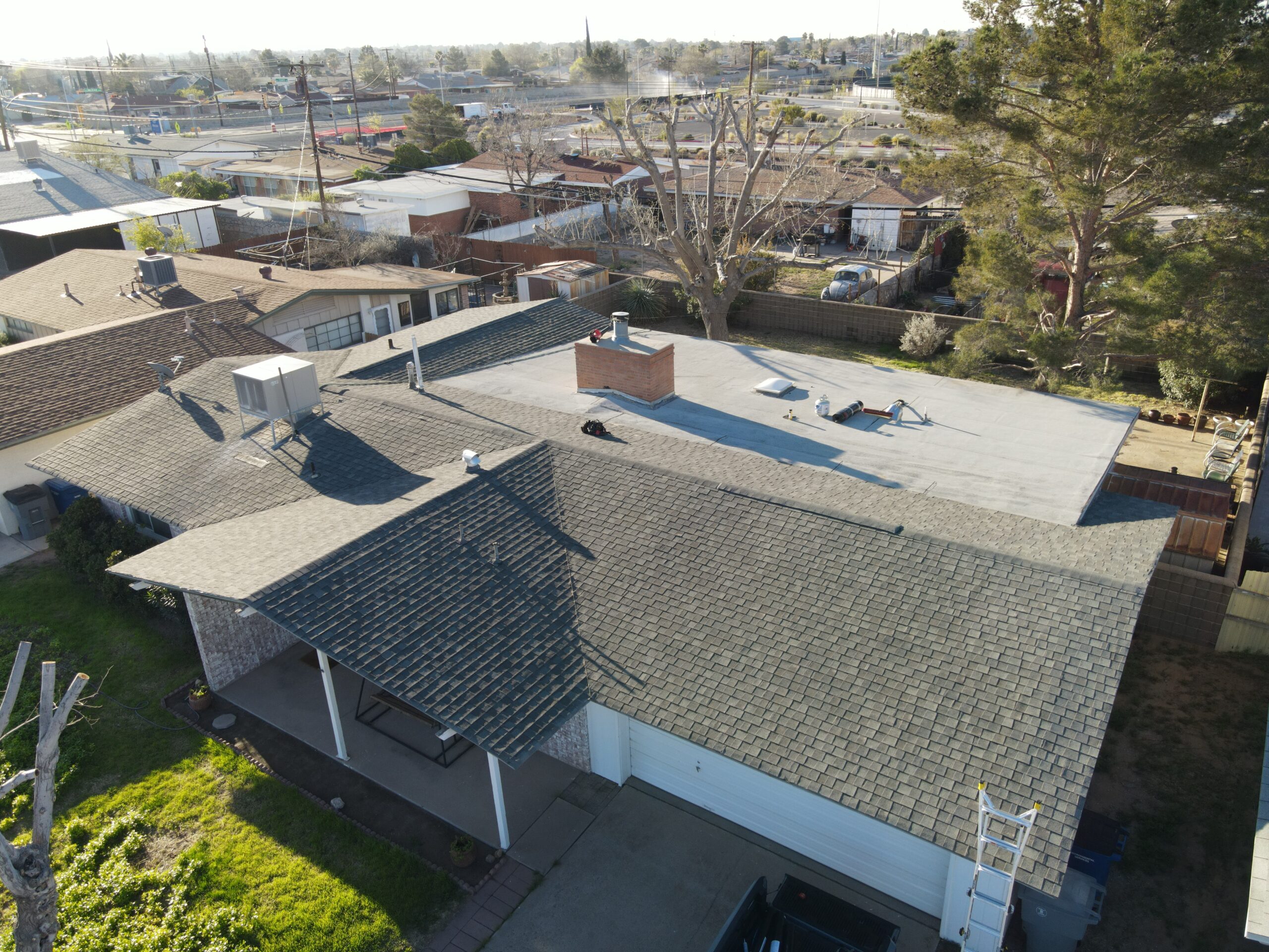 S&M Quality Roofing crew working on a residential roof in El Paso